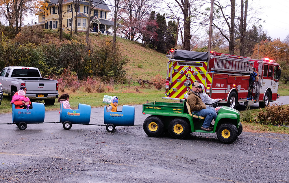 The littlest tractor and passengers were the first to arrive at the Locust Grove Brewing Company for the Grand Opening.